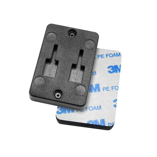 The Vertical Female Dual T-Slot to 4-Hole AMPS Adapter features a black rectangular plastic bracket with two slots and screw holes, plus a blue 3M adhesive foam pad—ideal for quick car dashboard mounting.