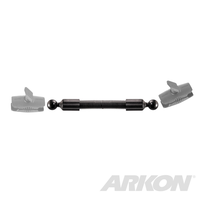 The 10 inch Double Socket Arm Extension Pole with 25mm (1 inch) Ball Ends features a metal spring-loaded connector rod, two ball joints, and comes with semi-transparent gray mounting brackets designed for the Arkon Robust Mount 25mm pattern. ARKON logo shown bottom right.