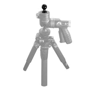 The 1/4-20 Camera Thread to 25mm Swivel Ball Adapter is shown in full color, attached to a handheld grip with a textured handle, adjustment knobs, and mounted on a semi-transparent tripod.