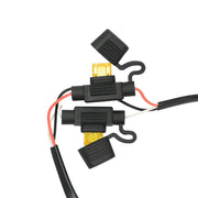 Two black inline fuse holders with yellow fuses are shown with red and white wires attached, designed for hardwiring the 30W 2-Port Quick Charge 3.0 and USB-A Car Fixed Install Charger, with open protective caps on a white background.