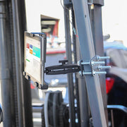 The LockVise™ Metal Locking Forklift Front Guard Tablet Mount with 7.25 Shaft securely fastens a tablet to forklift frames using bolts and clamps, providing a reliable warehouse mounting solution for industrial use.