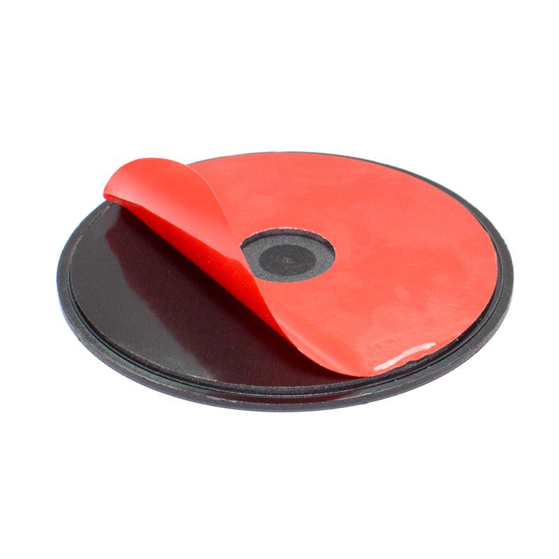 The 80mm VHB Adhesive Mounting Disk for Car Dashboards, GPS, and Smartphones is a round black disk with a central hole and red 3M VHB adhesive film—ideal for secure dashboard mounting.