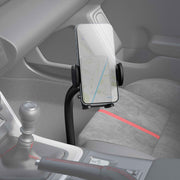 A smartphone with a navigation map is mounted on the Car or Truck Seat Rail or Floor Mega Grip™ Phone Holder Mount, attached near the gear shift and handbrake, with gray and red interior accents in view.