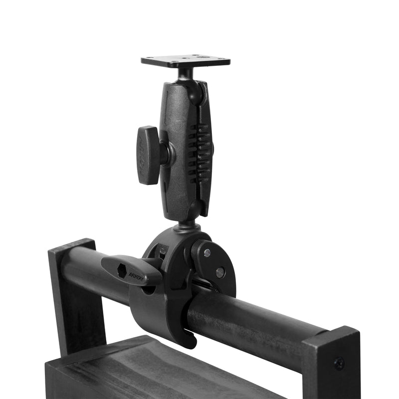 A black RoadVise® Clamp with Metal AMPS Mounting Plate and pivoting arm is mounted to a horizontal metal bar, offering a versatile device mount, shown isolated on a white background.