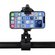 A smartphone is mounted horizontally in a RoadVise® Ultra Holder with Multi-Angle Arm and Clamp Mount, attached to a bar, showing various app icons and weather information on its screen.
