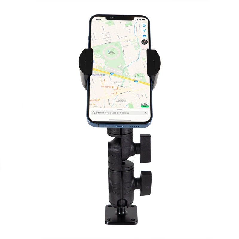A smartphone is mounted vertically on the black RoadVise® Ratchet Phone Holder with Drill Base Mount, displaying a map app. The universally compatible holder with a secure drill base is attached to a flat surface.