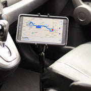 A Slim-Grip® Ultra Phone Seat Rail or Floor Car Truck Mount holds a smartphone displaying navigation to Lansing, securely positioned by the drivers seat and gear shift for easy access.