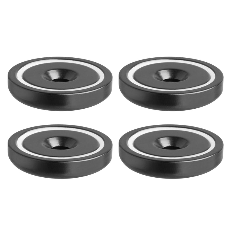 Four SteadyMag™ Magnetic Bases with Hardware, black and round with a white inner ring and central hole, ideal for use with a mounting bracket, are arranged in a 2x2 grid on a white background.