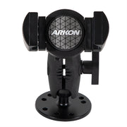 The black RoadVise® XL Holder with a circular drill-base mount features adjustable arms for secure phone mounting on flat surfaces. The Arkon logo appears on the front.