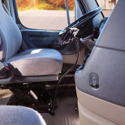 The Car or Truck Seat Rail Universal Slim-Grip® Tablet Mount with a 28-inch gooseneck is installed near the driver’s seat for convenient tablet access in vehicles with gray fabric seats and dashboard controls.