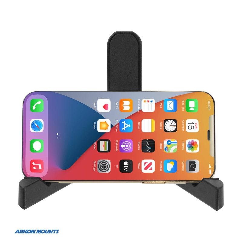 A smartphone displaying its home screen is placed horizontally in a black Portable Tablet/Phone Stand. The Arkon Mounts logo appears in the bottom left corner, making this stand an ideal accessory for working from home.