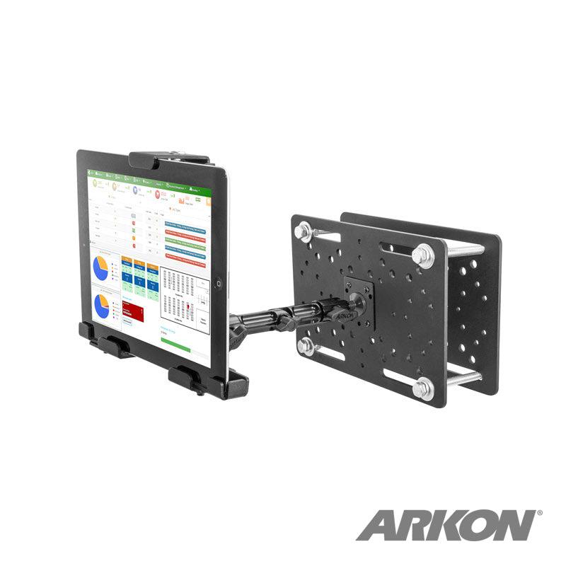 The LockVise™ Metal Locking Overhead Guard Tablet Mount with Multi-Pivoting Arm securely holds a tablet showing data charts. Its sturdy, adjustable black design is ideal for warehouse vehicle use. The Arkon logo appears in the bottom right corner.