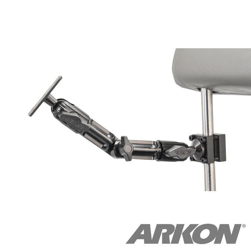 The Heavy Duty Aluminum Car Headrest Mount with 4-Hole AMPS Head attaches to a metal chair frame, offering an adjustable black mounting arm ideal for backseat entertainment. The ARKON logo appears in the bottom right corner.