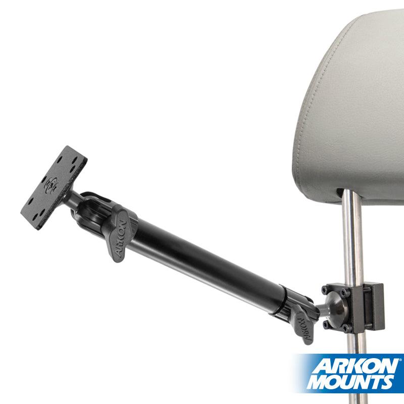 The Heavy-Duty Headrest Mount with 10 inch Arm, a black adjustable tablet holder, attaches to a car headrest for rear passenger use. Features 4-Hole AMPS compatibility. The Arkon Mounts logo appears in the lower right corner.