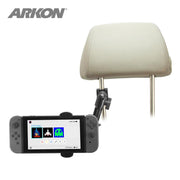 The Heavy-Duty Multi-Angle Headrest Mount in black securely holds a Nintendo Switch (home screen visible) as a rear seat entertainment solution, with both the car headrest and device contrasting against a white background.