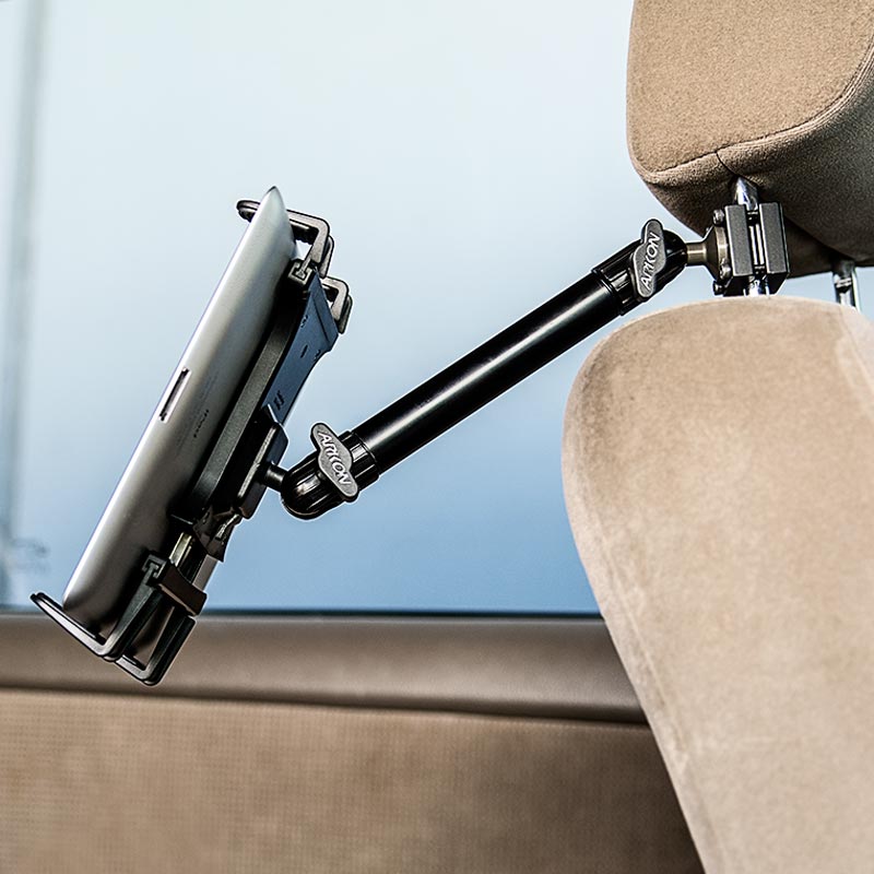 A Heavy-Duty Slim-Grip® Tablet Headrest Mount with 10 Arm holds a tablet on a car seat headrest, providing adjustable rear seat entertainment and convenient viewing for backseat passengers.