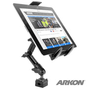 The Heavy-Duty Tablet Headrest Push-Button Multi-Angle Mount with 8 Arm securely holds a tablet (showing a website) with the ARKON logo visible, featuring multiple joints and a clamp base—ideal for rear seat entertainment in your car.