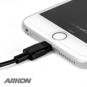 A close-up shows the Lightning to USB Charging Cable for iPhone, iPad and iPod plugged in, with slide to unlock on screen and the ARKON logo visible. Apple MFI Certified accessory.
