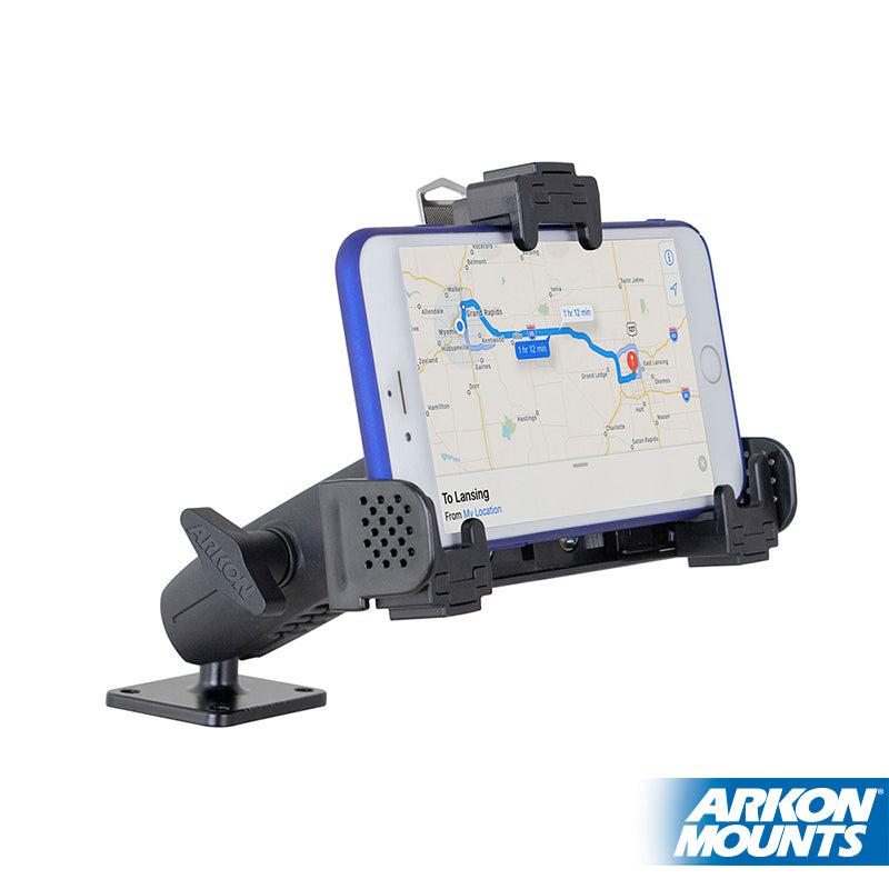 A smartphone is held in the LockVise™ Locking Phone Mount with 2.75 Arm and Metal AMPS Drill Base, displaying a GPS map. The adjustable holder is mounted on a flat surface, with the Arkon Mounts logo visible in the lower right corner.