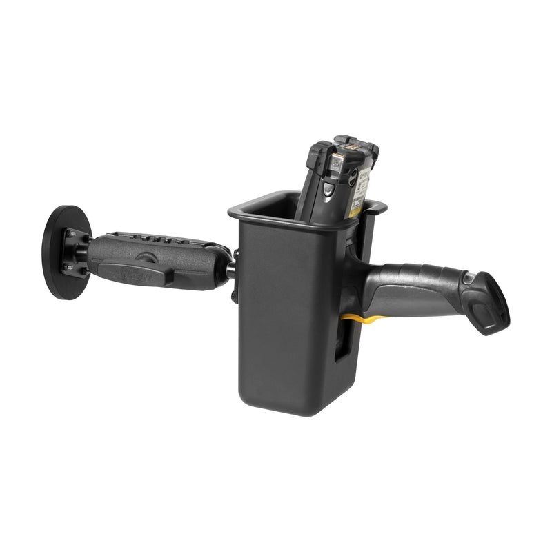 A Magnetic Mount with Barcode Scanner Holster Holder secures a black pistol grip barcode scanner in a warehouse, attached to the wall with an adjustable arm.
