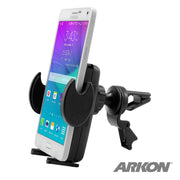 A smartphone is held in a black adjustable Car Vent Mount with Mega Grip™ Holder, its screen on. This universal phone holder displays the Arkon logo in the bottom right corner.