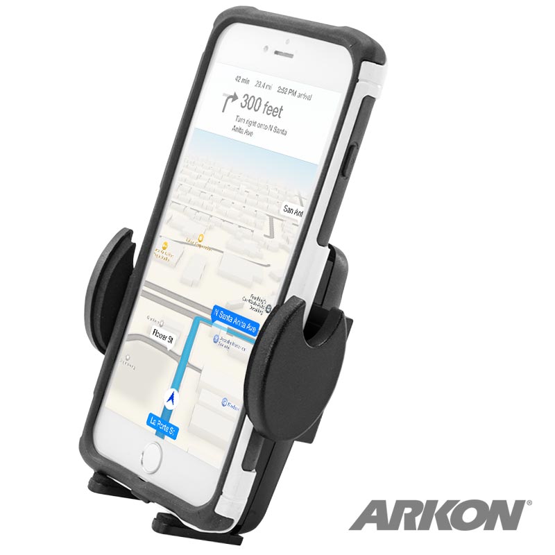 A smartphone displaying GPS directions is secured in the Mega Grip™ Universal Phone Holder for iPhone, Galaxy, and Note, with the ARKON logo visible in the bottom right of the screen.
