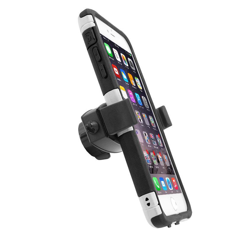 A smartphone in a black and white case is held in the Mobile Grip 2 Universal Phone Holder, displaying app icons. The adjustable mount, suited for iPhone, Galaxy, Note, and more, attaches easily to surfaces like a car dashboard or vent.