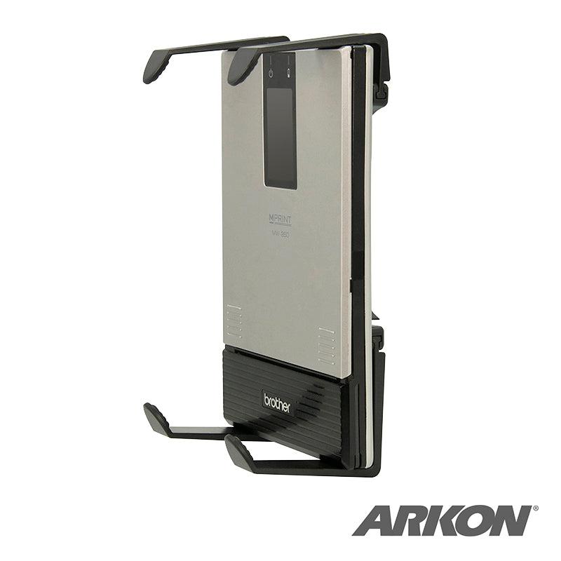 A Mobile Portable Printer Holder with AMPS Pattern for Zebra, Epson, and Brother printers holds a compact Brother mobile printer in a black Slim-Grip Holder with four arms on a 4-Hole AMPS bracket. The ARKON logo is at the lower right on a white background.
