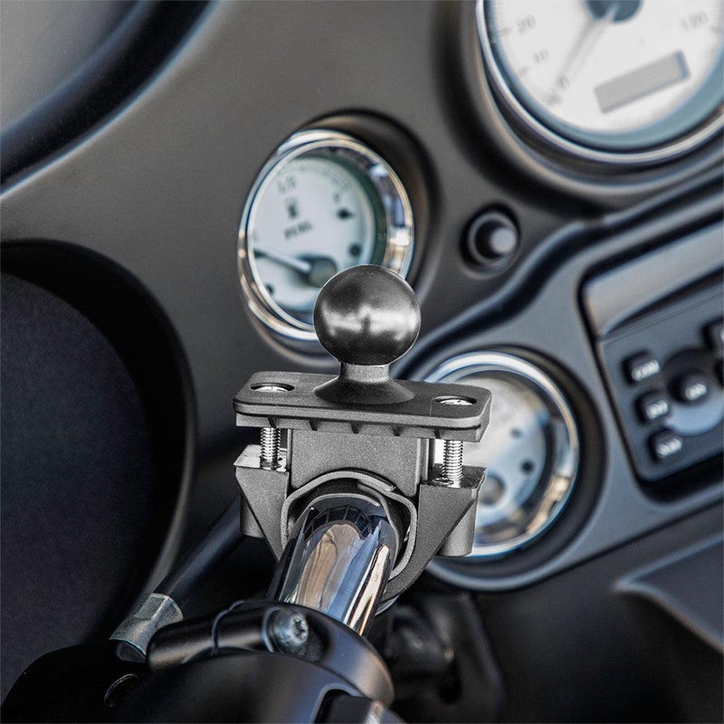 Close-up of the Motorcycle or Bicycle Handlebar Mount - 25mm (1 inch) Ball Compatible, attached to a handlebar in front of a dashboard featuring three circular gauges and control buttons.