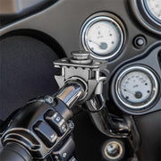 Close-up of the OCTO™ Series Motorcycle or Bicycle Handlebar Mount securely attached to a handlebar; dashboard gauges and control buttons appear in the background, ensuring compatibility with octagon pattern accessories.