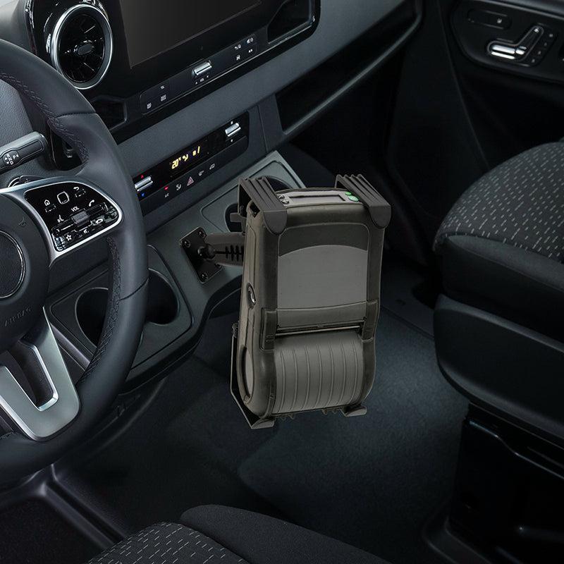 The Portable Mobile Printer Car Truck Drill Base Mount secures Zebra, Epson, or Brother printers between the driver and passenger seats, powered via the cars dashboard outlet for convenient in-vehicle printing.