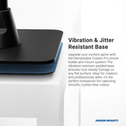 Close-up of the Remarkable Creator™ Cookie Decorators Mount Stand for Phones and Pico Projectors on a white table, showing its blue, vibration-resistant padding for stable video recording. Arkon Mounts logo is visible in the corner.