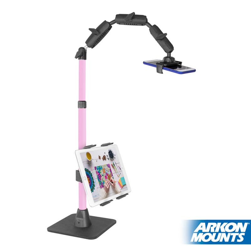 The Remarkable Creator™ Pro+Plus with Pink Extension Pole, featuring a pink and black design, holds your smartphone on top and tablet below. Its sturdy base and flexible arm make it an ideal stand for any setup.