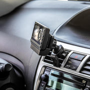 A close-up of a dashboard shows a Removable Swivel Air Vent Car Mount for XM and Sirius Satellite Radio securely attached above the audio and climate controls.