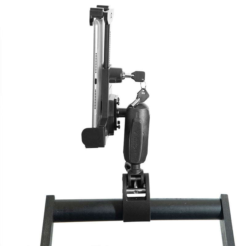 A RoadVise® Clamp Mount with LockVise™ Locking Tablet Holder and 3.5” Arm is shown front-facing on a horizontal bar with a tablet secured inside; a key is inserted into the holders lock, all set against a white background.