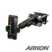 A smartphone is mounted in a black RoadVise® Forklift Front Guard Phone Mount with a sturdy metal base and bolts. The screen shows a graph, and the Arkon logo appears at the bottom right.