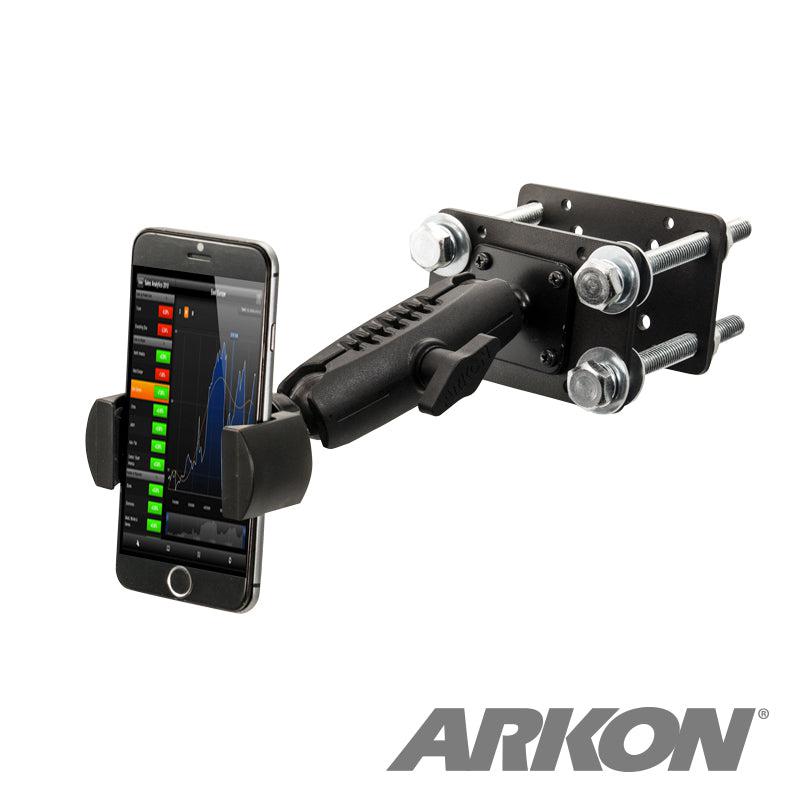 A smartphone is mounted in a black RoadVise® Forklift Front Guard Phone Mount with a sturdy metal base and bolts. The screen shows a graph, and the Arkon logo appears at the bottom right.