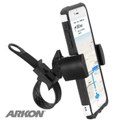 A smartphone mounted on a black, adjustable RoadVise® Motorcycle Phone Mount with Strap displays a map with directions. The ARKON logo appears in the lower left corner.