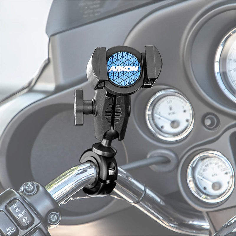 The RoadVise® Phone Holder with Aluminum Handlebar Mount and 2.75 Shaft is attached to a motorcycles handlebar, with dashboard gauges and controls in view. The holder has a blue textured center labeled ARROW.