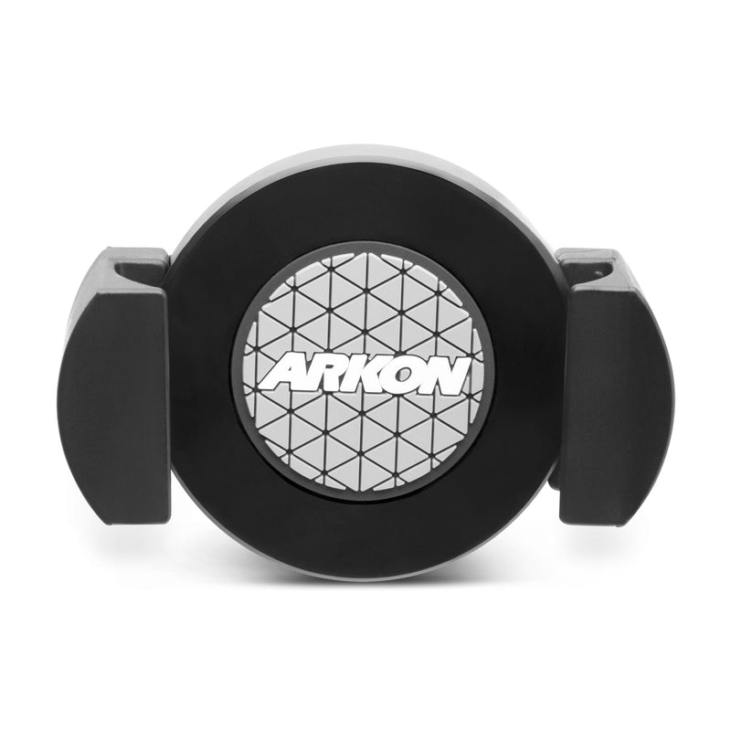 The RoadVise® XL Phone and Midsize Tablet Holder is a black circular mount with two adjustable side grips, a geometric patterned center, and the white ARKON logo, designed for secure device holding and 17mm ball mount compatibility.