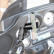 A RoadVise® XL Phone and Midsize Tablet Holder with Handlebar Collar Mount and 2.75 Shaft secures a smartphone showing navigation on a motorcycle, with the dashboard and gauges visible in the background.