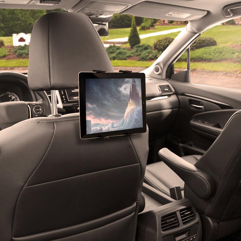 A Slim-Grip® Tablet Headrest Mount secures a tablet showing a fantasy scene to the back of a car’s front seat. The sleek black interior and suburban views outside make it the perfect rear seat entertainment solution.