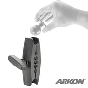A hand holds the Robust™ Series 5 inch Metal Mount Shaft (38mm/1.5 ball compatible) above a black mounting arm from Arkons Robust Mount Series, with the ARKON logo in the corner, illustrating attachment or assembly.