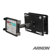 A Slim-Grip® Tablet Holder with Forklift Overhead Guard Mount and 6 Metal Shaft securely holds a tablet in landscape mode, featuring adjustable arms and a perforated backplate with bolts for solid mounting.