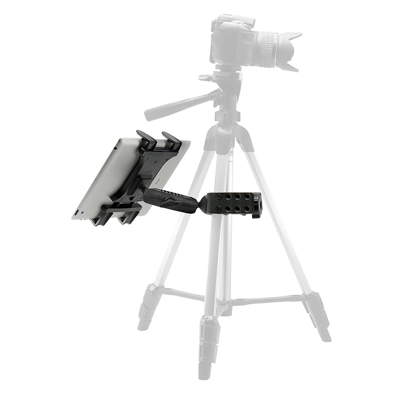 A Slim-Grip® Tablet Holder with Heavy-Duty Clamp Mount is secured to a tripod before a DSLR camera, showing how to mount your tablet with a camera tripod. The camera and tripod appear softly blurred in the background.