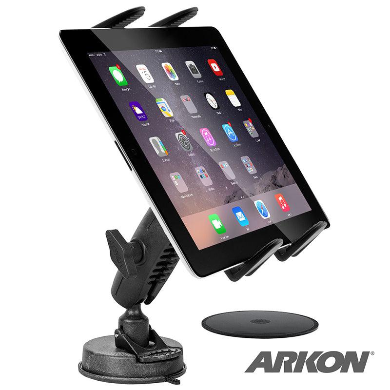 A tablet is secured on a Slim-Grip® Tablet Holder with Heavy-Duty Sticky Suction Windshield or Dash Mount, displayed at an angle. The Arkon logo appears at the bottom right, next to an adhesive disc by the holder.