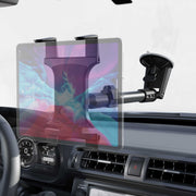 The Slim-Grip® Tablet Holder with Windshield Suction Mount and Extension Arm attaches to your car dashboard near the steering wheel and air vents, providing a secure and adjustable spot for your tablet.