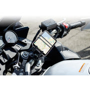 A Slim-Grip® Ultra Holder with Bike Mount secures a smartphone displaying a map on the handlebars, with the dashboard and part of the speedometer visible in the background.