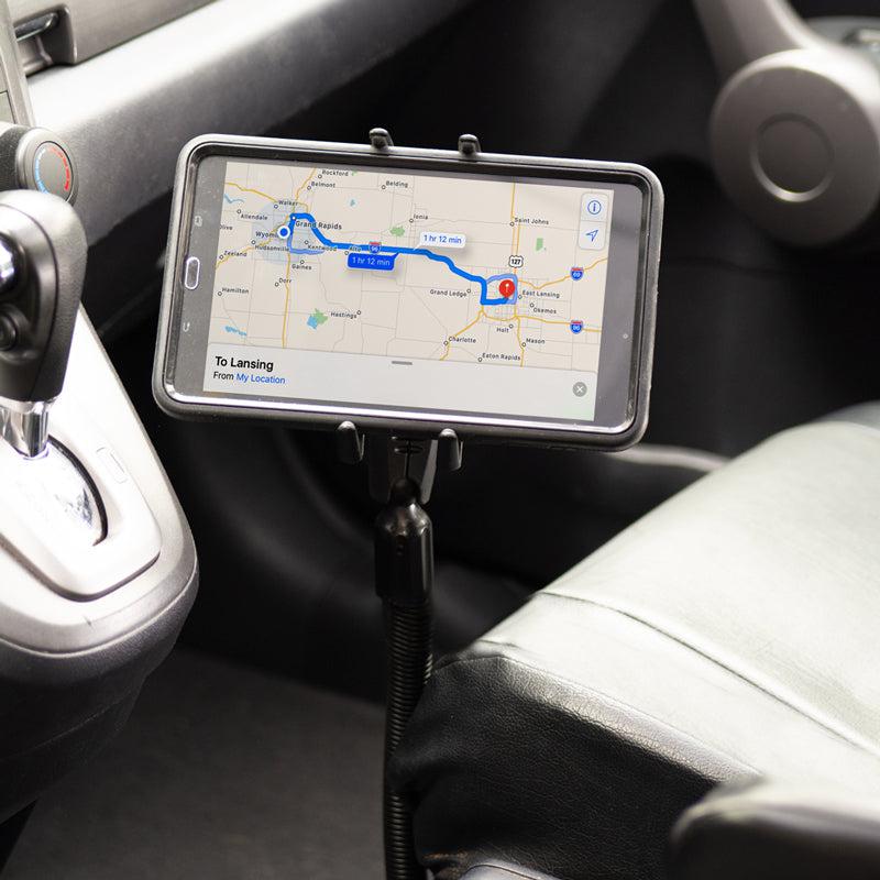 A Slim-Grip® Ultra Phone or Midsize Tablet Seat Rail Mount holds a smartphone by the driver’s seat, displaying navigation directions for convenient and safe in-car use.