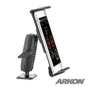 A black Slim-Grip® Ultra Robust Tablet or Phone Mount with Metal AMPS Base holds a smartphone upright, displaying an app with circular graphics. The versatile mount is shown clearly, with the Arkon logo visible at the bottom right corner.